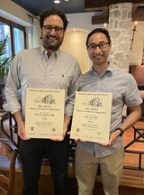 Tunc and Calvin with certificates